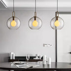 Glass pendant light cluster mixing capsule and sphere shapes