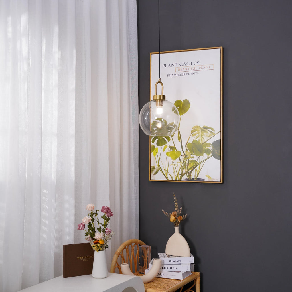 Glass pendant light hanging with a soft, warm diffused glow