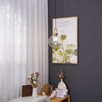 Glass pendant light hanging with a soft, warm diffused glow