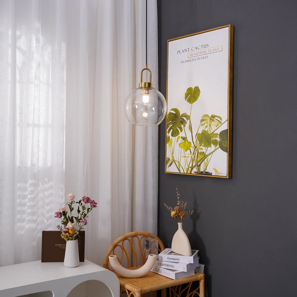 Glass pendant light with copper-plated fitting and clear shade