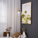 Glass pendant light shades in capsule and sphere forms