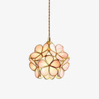 Single handblown glass petal pendant light shown isolated