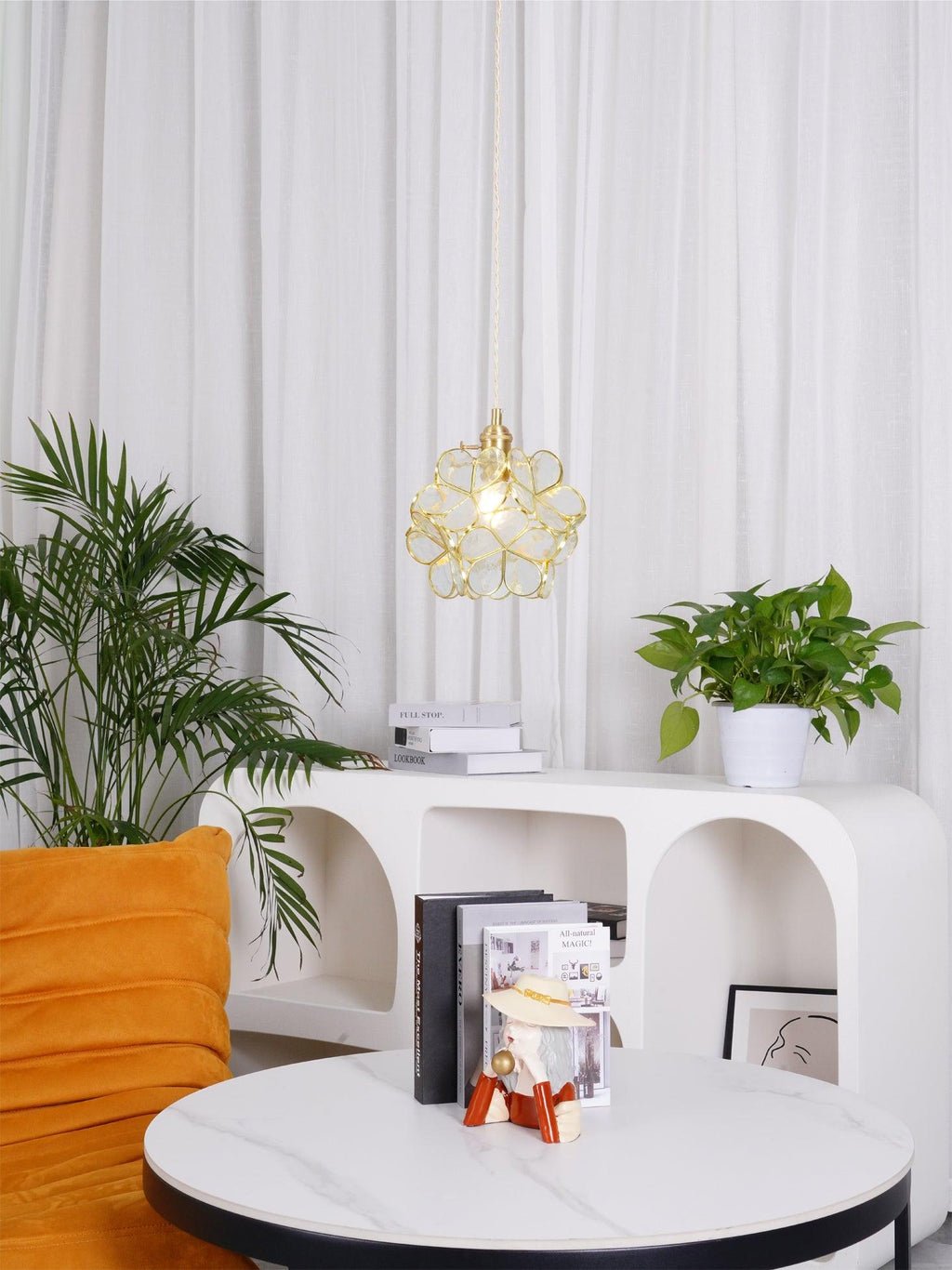 Handblown glass petal pendant light with petal-shaped shade lit