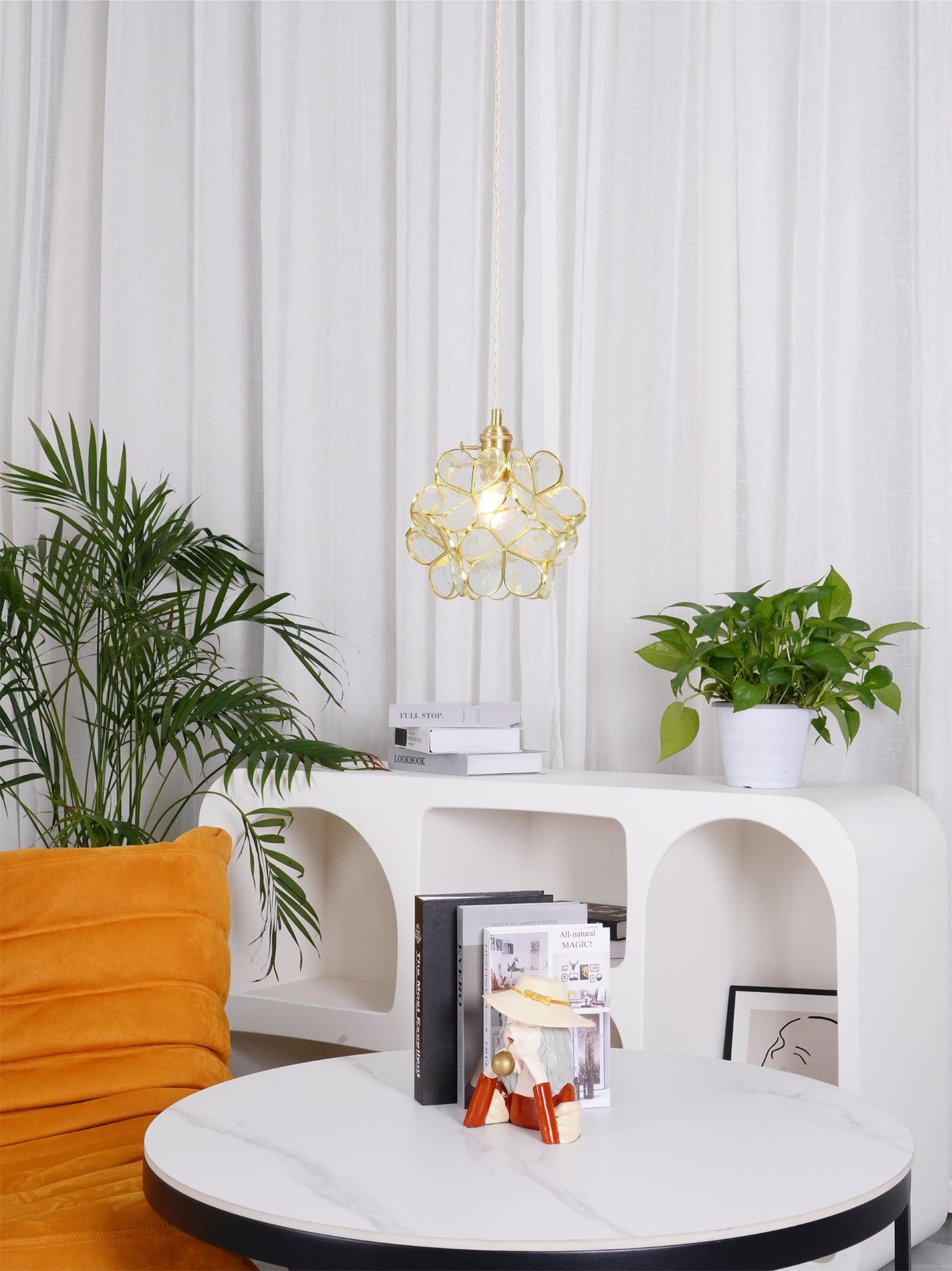 Handblown glass petal pendant light with petal-shaped shade lit