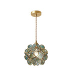 Blue handblown glass petal pendant light softly lit