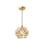 Glass petal pendant light cluster over a kitchen counter