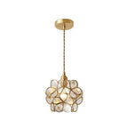 Yellow glass petal pendant light with brass fitting lit