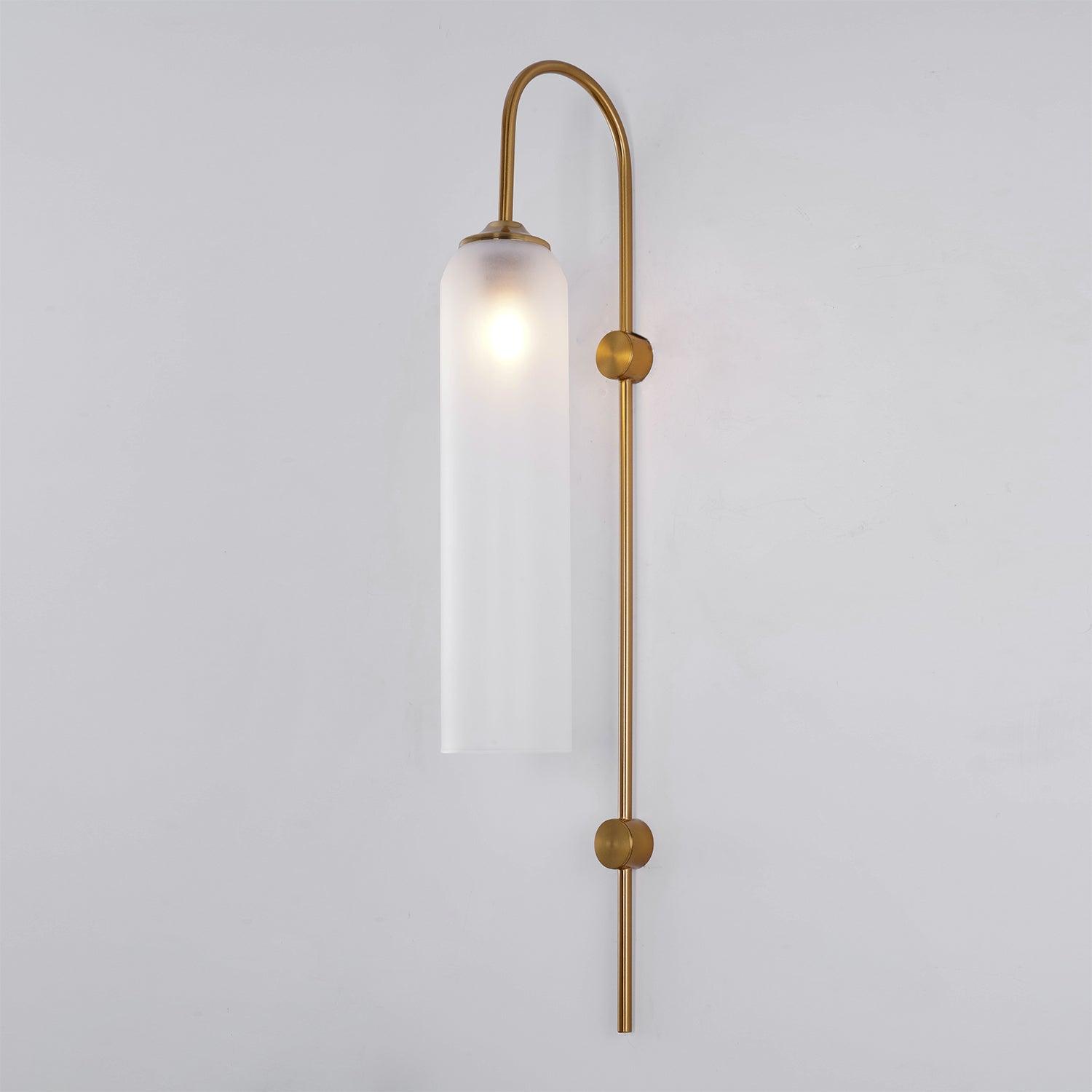 Glass wall sconce pendant shown lit on a wall