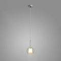 Glo blown glass globe pendant light hanging over a table