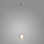 Glo blown glass globe pendant light hanging over a table