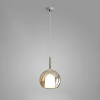 Smoke gray glass globe pendant light over a dining table