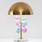 Globo table lamp glowing warm against a dark interior backdrop