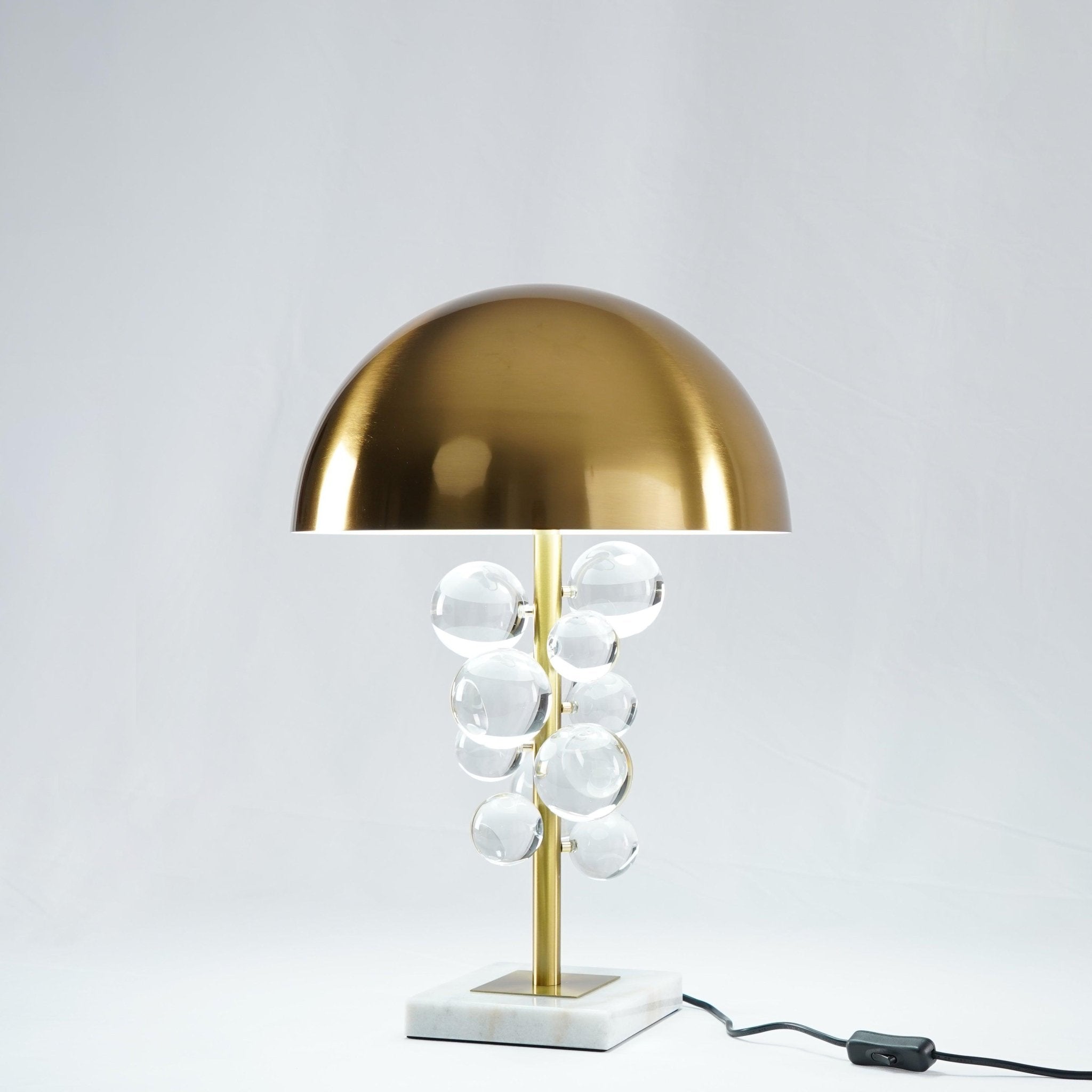 Warm light scattering through clustered glass spheres on the lamp