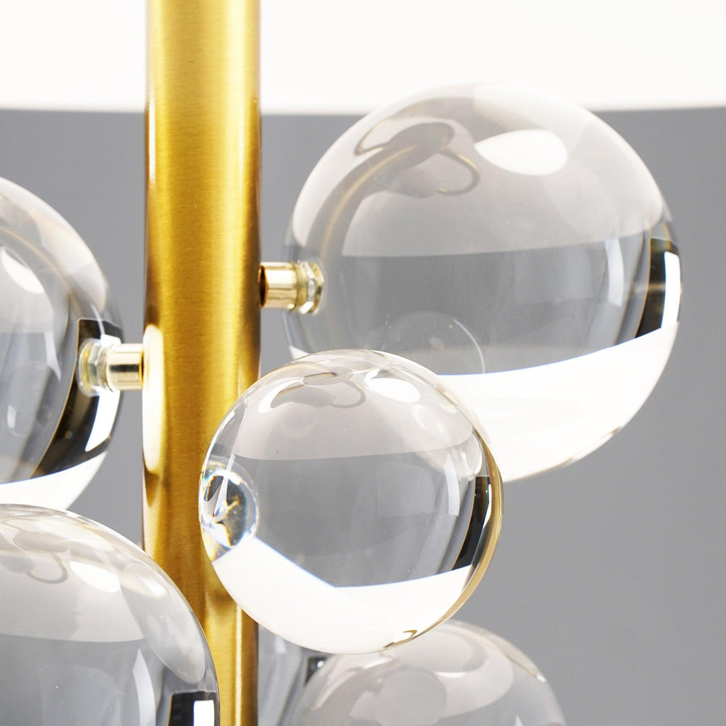 Detail of warm light glowing through clear glass spheres