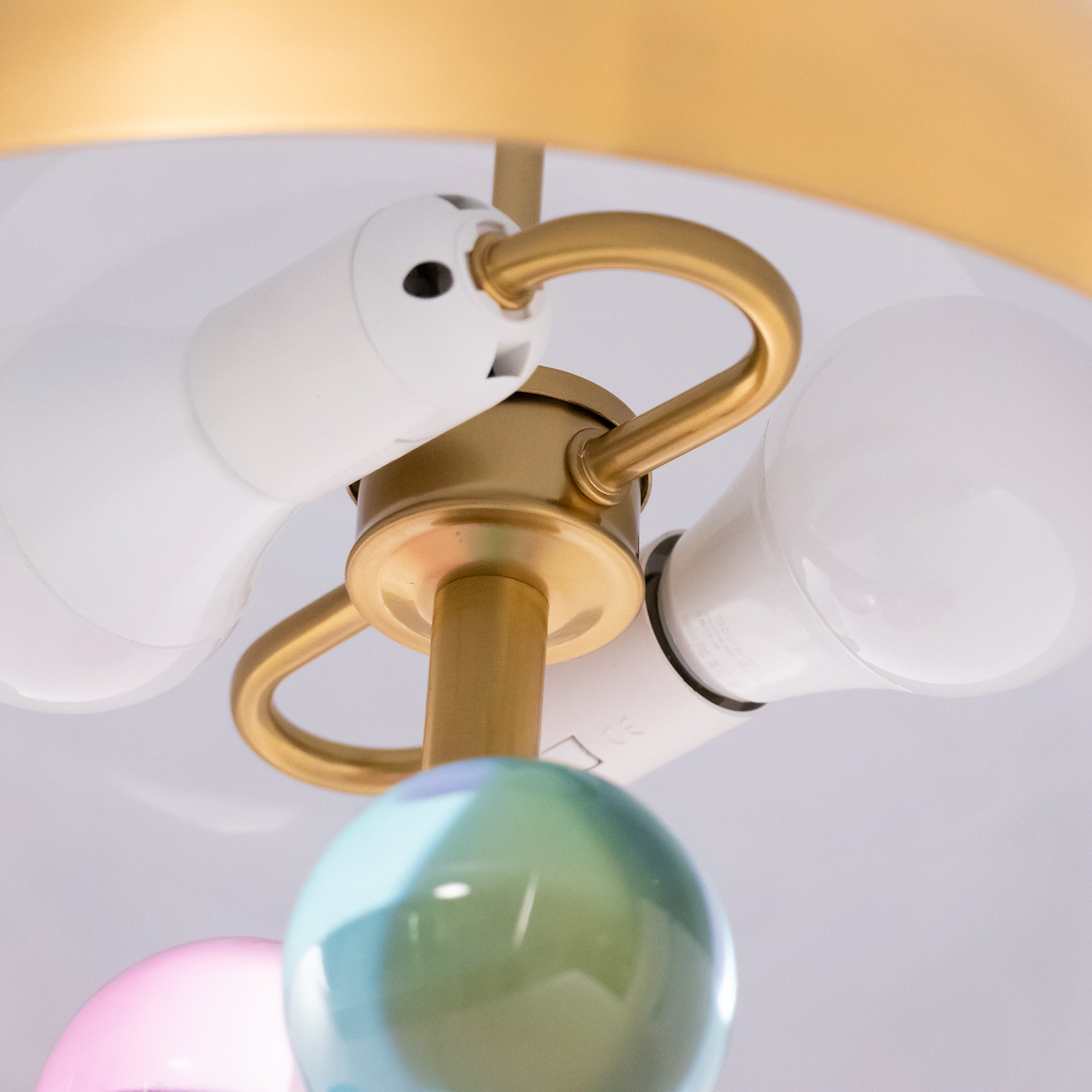 Glass sphere table lamp with white marble base on display