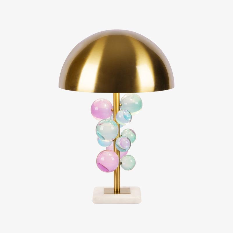 Globo glass sphere lamp glowing warmly beside a dark backdrop