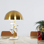 Glass sphere table lamp glowing warm in a softly lit room