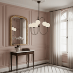 Gooseneck chandelier white glass globe and iron arm detail