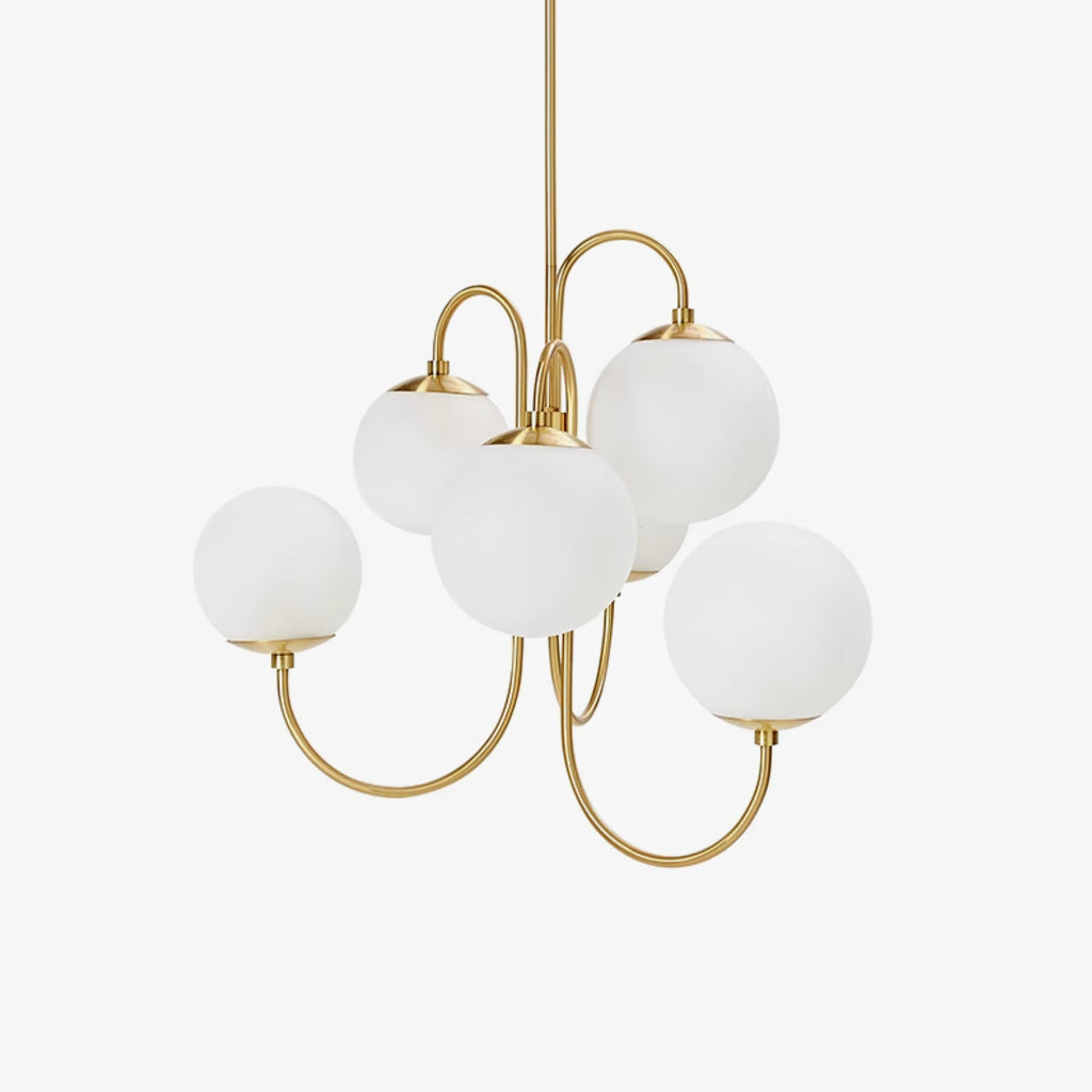 Wrought-iron gooseneck chandelier glowing over a dining table