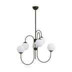 Gooseneck chandelier with white glass globes lit warmly