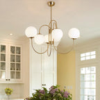 Wrought-iron gooseneck chandelier with glowing white globes