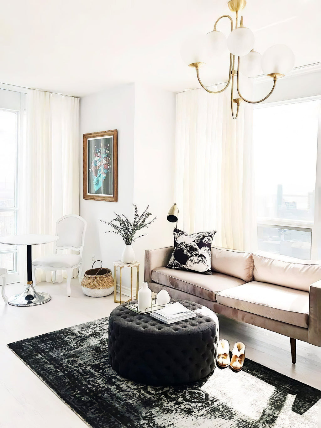 Wrought-iron gooseneck chandelier with curved arms and globes