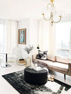 Wrought-iron gooseneck chandelier with curved arms and globes