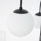 Gooseneck chandelier lighting a mid-century modern interior