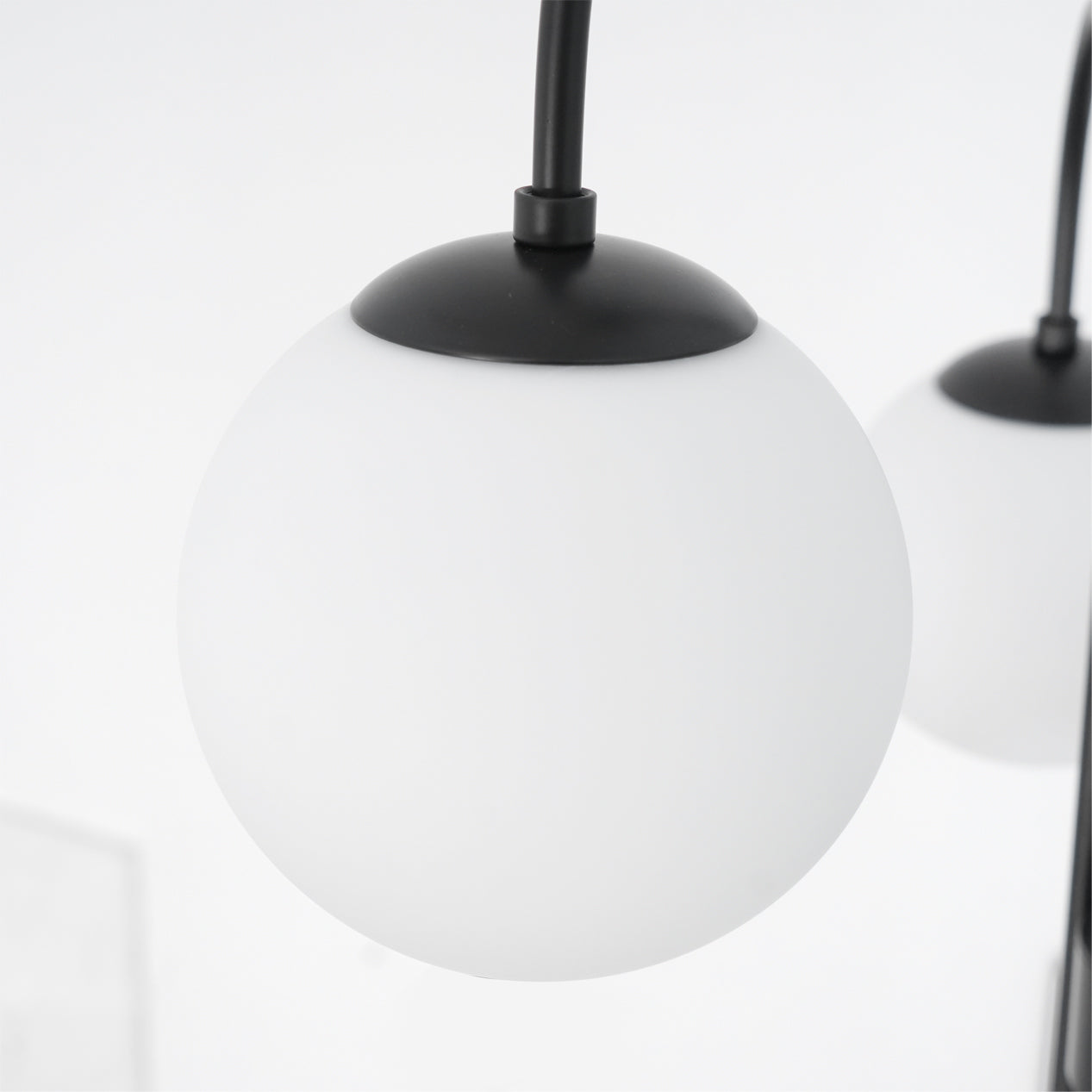 Gooseneck chandelier lighting a mid-century modern interior