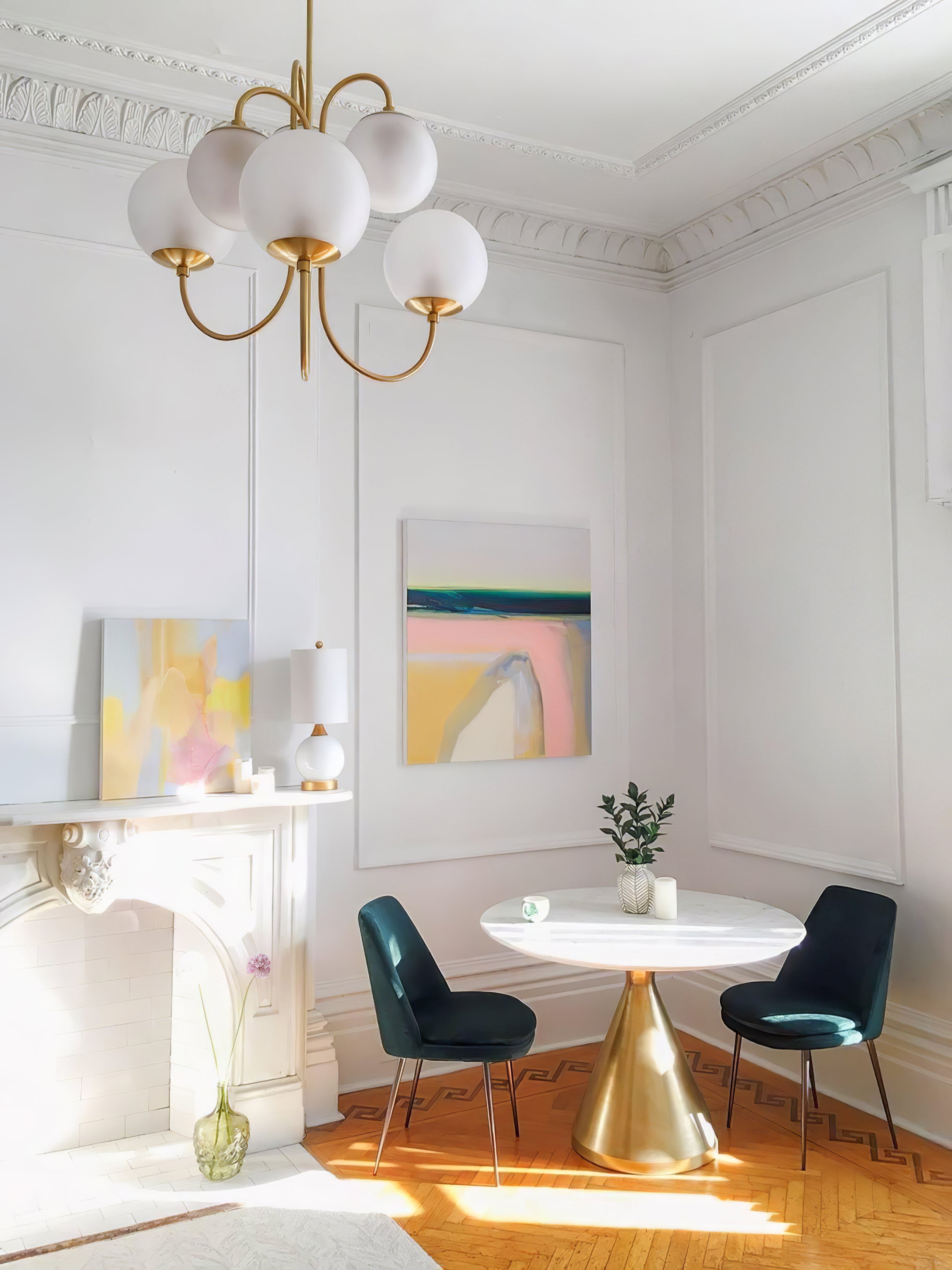 Gooseneck chandelier glowing softly above a living space
