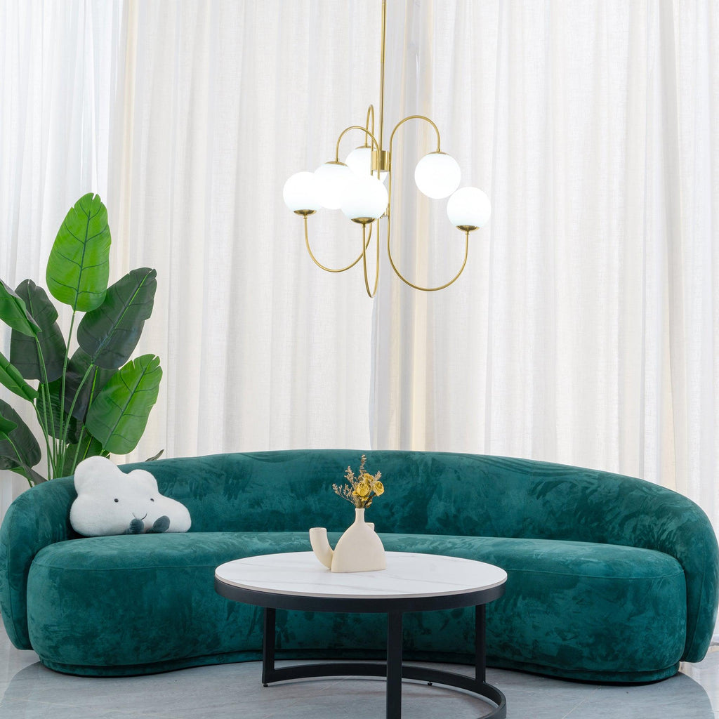 Wrought-iron gooseneck chandelier suspended in a bright room