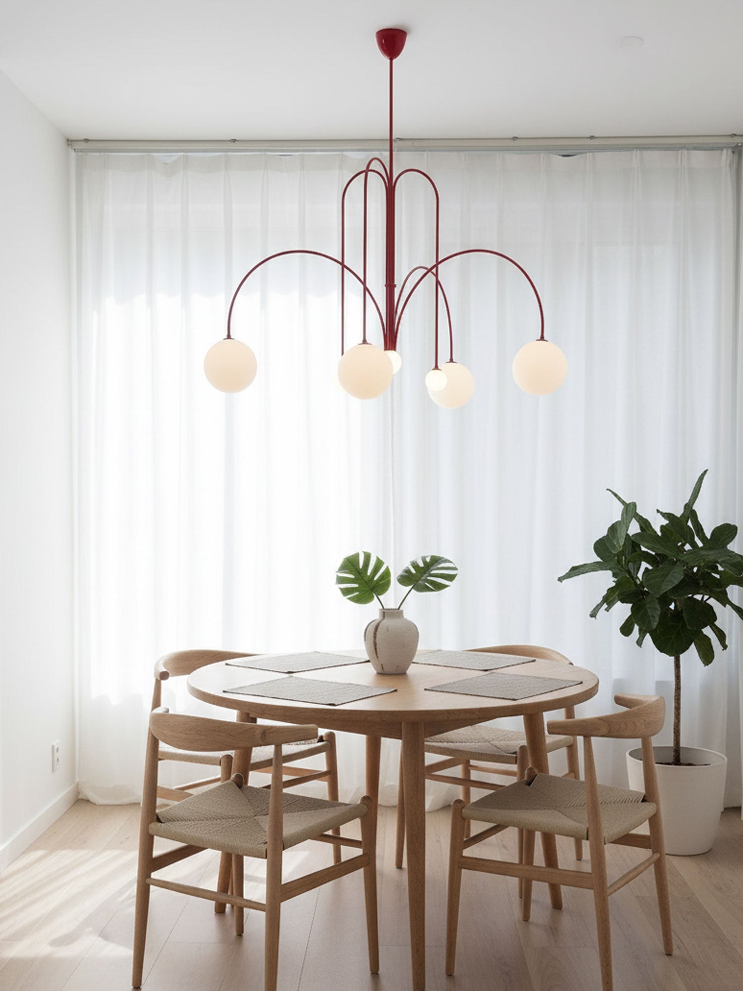 Six-head pendant light with sculptural arms and white shades