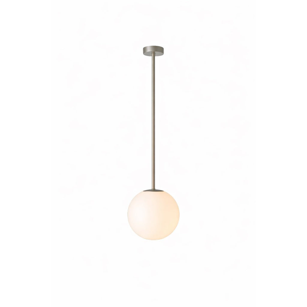Six-head suspension light glowing softly above a space