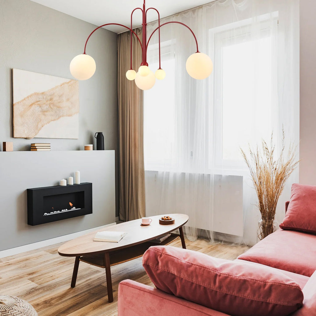 Glass suspension light with sculptural form and warm glow