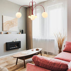 Glass suspension light with sculptural form and warm glow