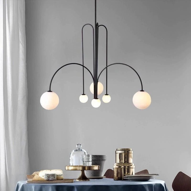 Gran Finale pendant light detail with glass shade and metal arm