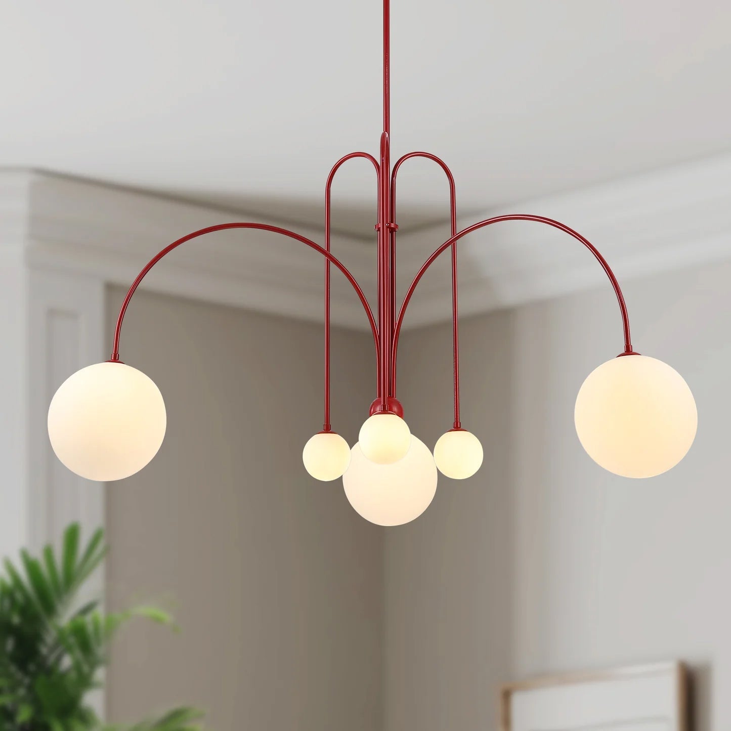 Glass pendant chandelier with six warm-lit white glass shades