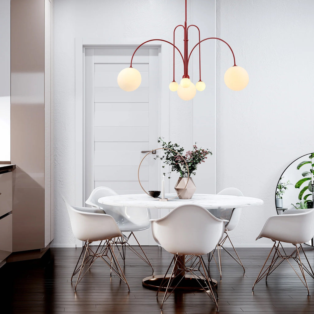 Six-head suspension light glowing in a styled interior setting