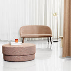 A curtained studio room holds this gold dome-shade Clérachic floor lamp behind a blush sofa and woven pouf.
