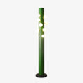 Against plain grey, the green Clérachic floor lamp's tube fades to a darker shade near its base while the globes glow above.