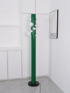 Shot from a slightly different angle, the unlit green Clérachic floor lamp stands alone in the white corner nook.