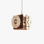 The pendant on white, brown and white glass discs set around a cube on a chrome chain.
