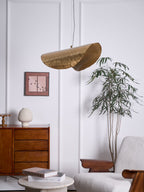 Unlit, this Clérachic hammered brass shade hangs once more near the framed print and cabinet.