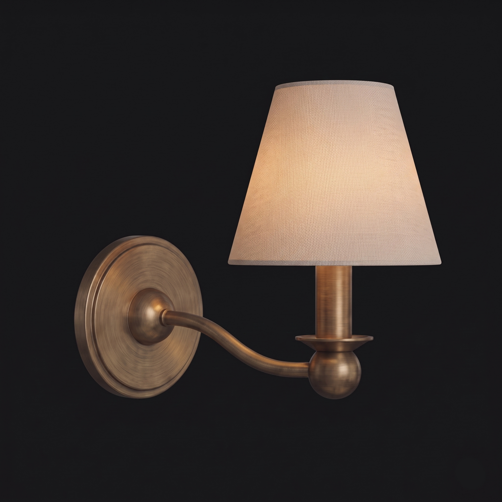 Shown unlit against a dark background, this brushed brass Clérachic wall sconce has a single fabric drum shade.