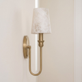 Angled product view of this Clérachic sconce in brass hardware, showing the curve of its U-loop arm clearly.