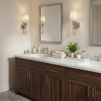 In a bathroom with a marble-top vanity, two of these Clérachic sconces in nickel hardware flank the mirror, lit warm.