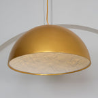 Hemisphere pendant light with warm glow in a neutral interior