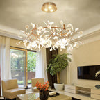 Rose gold branch chandelier suspended in an entryway