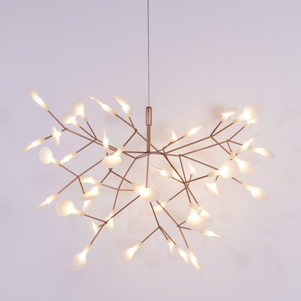 Rose gold firefly chandelier with leaves in a wide spread