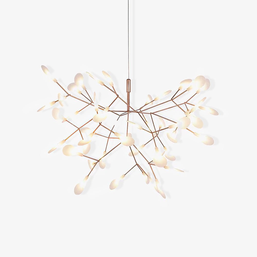 Rose gold branch chandelier glowing in an elegant space
